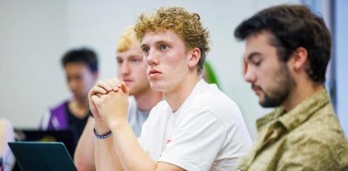 Student attentivley listens in class.